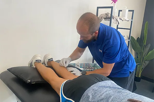 Physical therapist providing dry needling at True Health and Performance