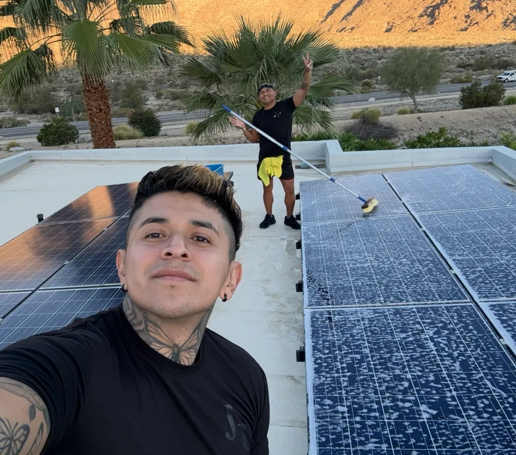 Clean service vehicle parked beside a home with AuriSun branding on the side; technicians loading equipment, mid-day light, photorealistic and composed to communicate reliability and local presence.