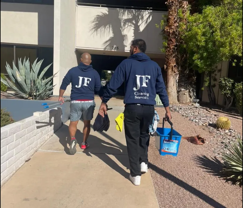 Clean service vehicle parked beside a home with AuriSun branding on the side; technicians loading equipment, mid-day light, photorealistic and composed to communicate reliability and local presence.