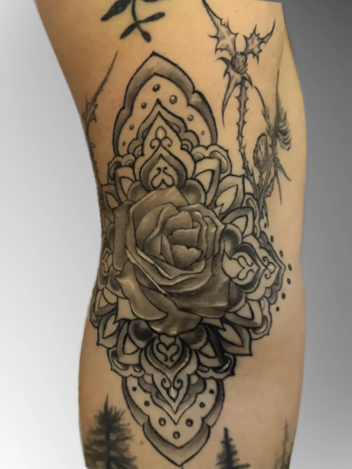 Abstract watercolor tattoo on a woman's shoulder, blending pastel pinks and blues with gold accents. The image is shot in a modern studio with a minimalist background. 1:1 aspect ratio.