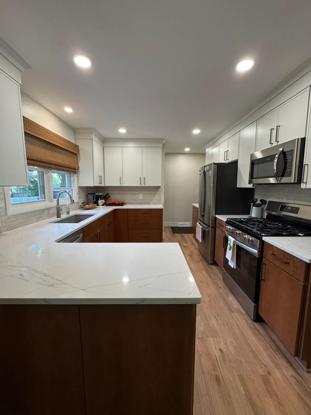 Custom kitchen remodel in progress featuring new lighting, appliance installation, and updated layout by Archstone Homes.