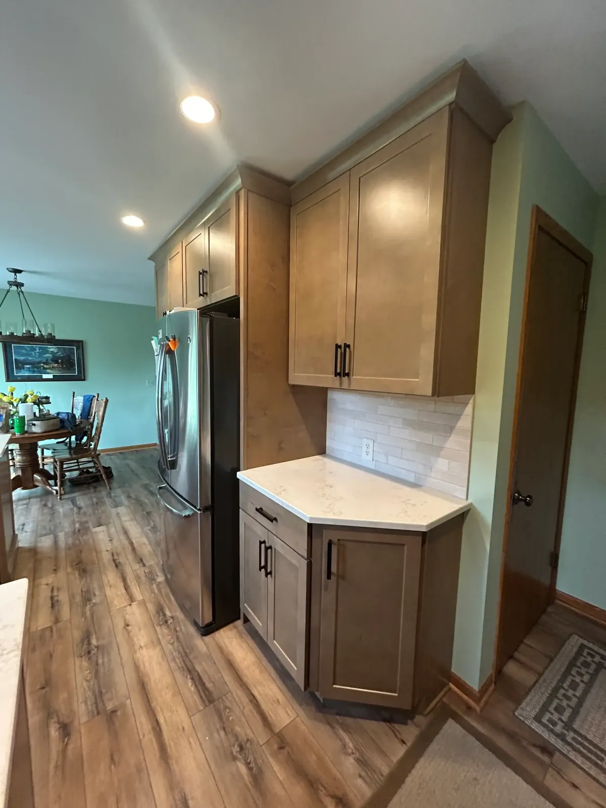 Finished kitchen renovation with custom cabinetry and hardwood flooring in Grand Rapids, MI