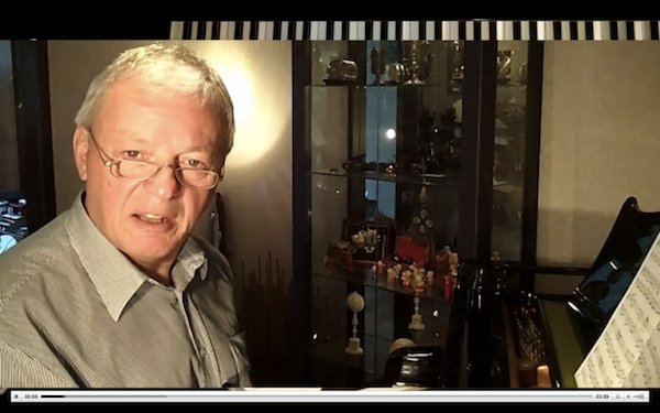 A red and white plane flying in the sky