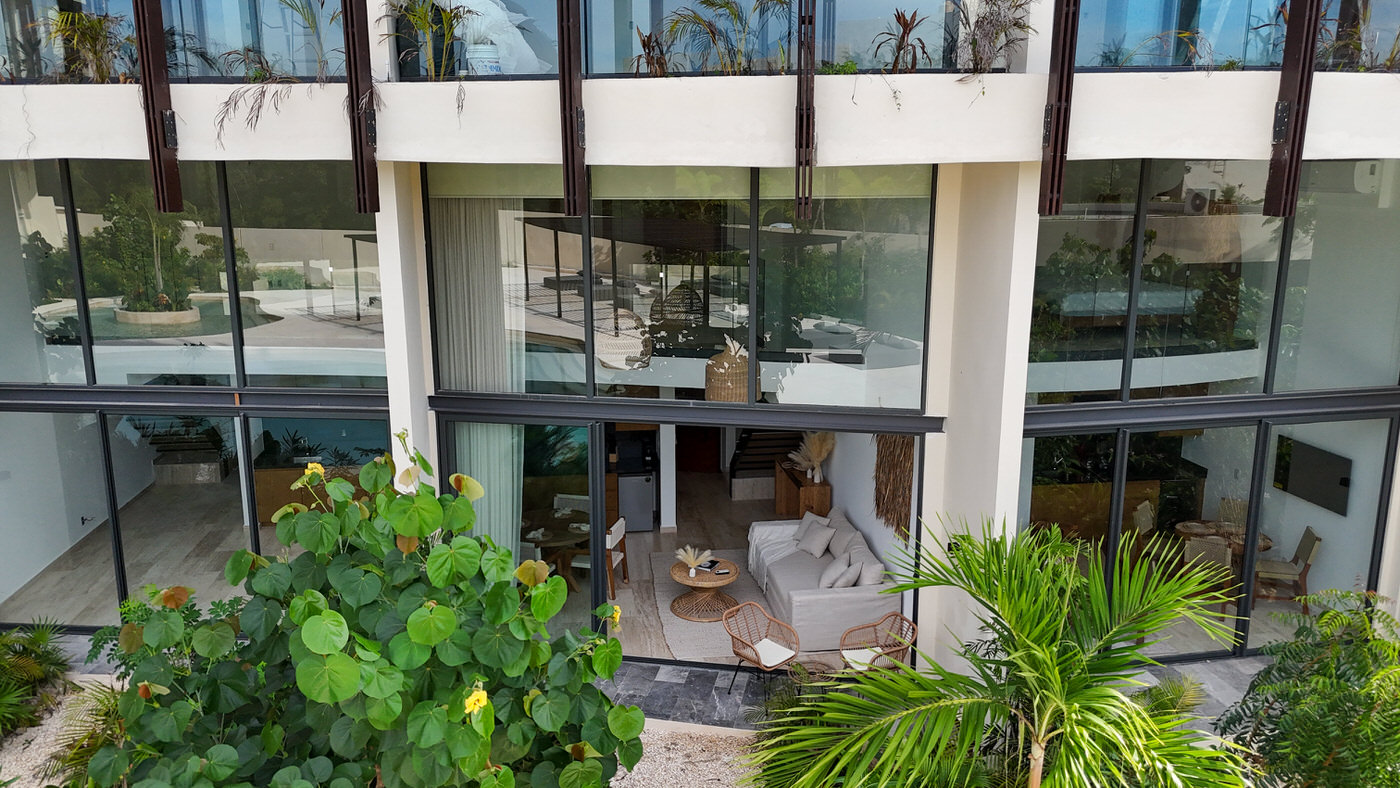One bedroom loft for 4 guests in Tulum, Mexico | Stunning Floor to Ceiling Windows | Private Setting | Tropical Vacation Rentals Mexico