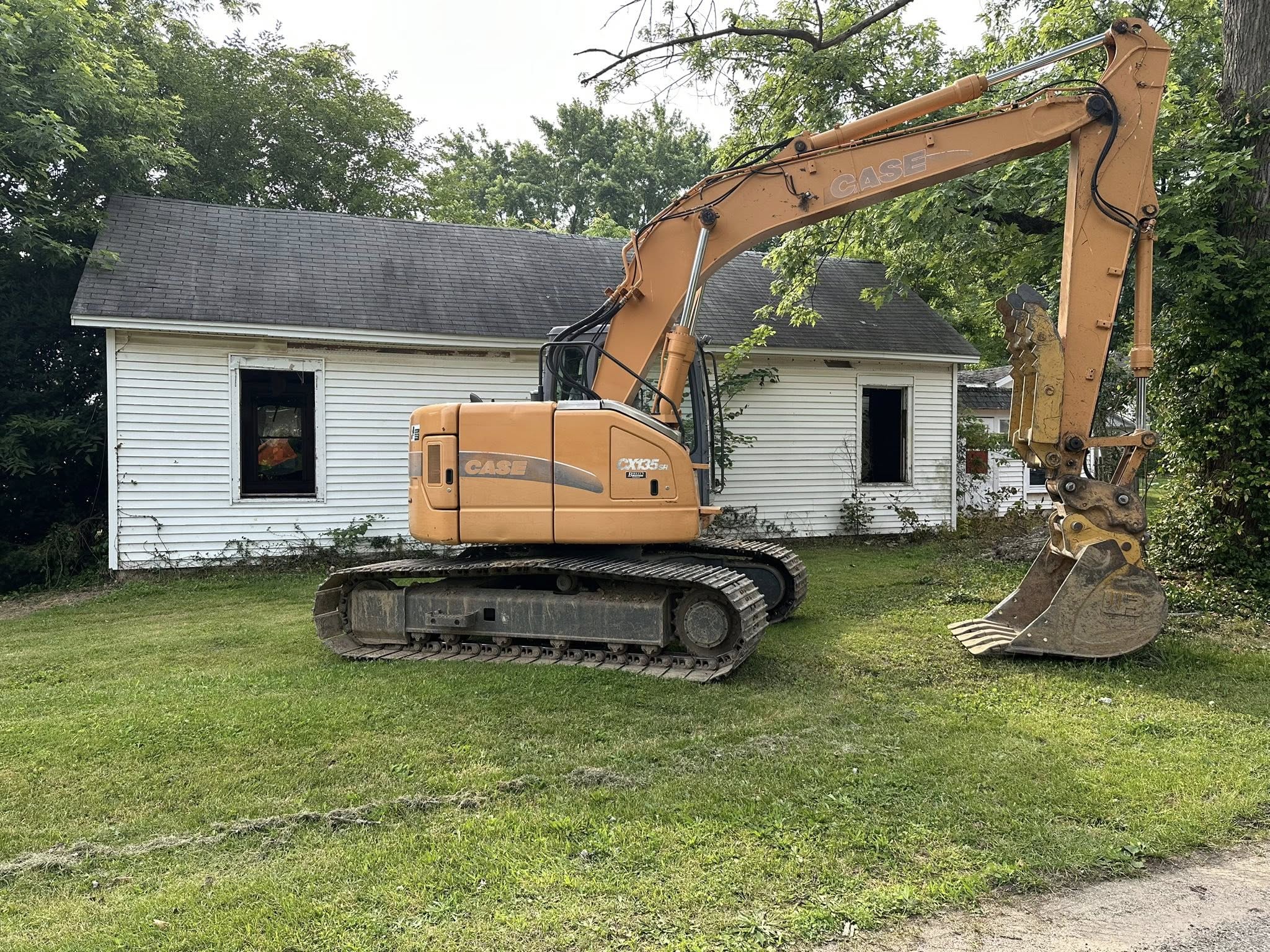 yellow and black heavy equipment on brown field during daytime