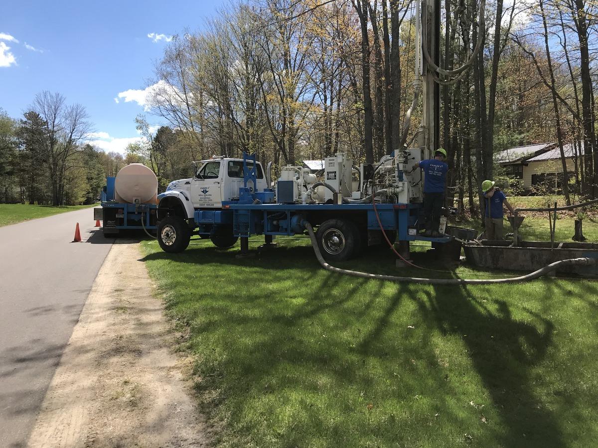 The Hart Well Drilling Crew Hard at Work Utilizing the Work Truck