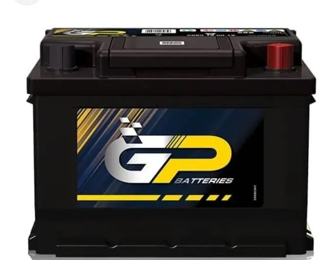 Technician performing onsite battery test in driveway