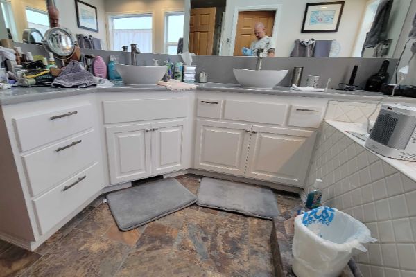 Factory-finish kitchen cabinet transformation and spraying in a Lane County home remodel.