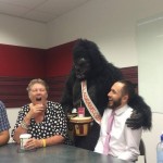 Gorilla oman and man sitting