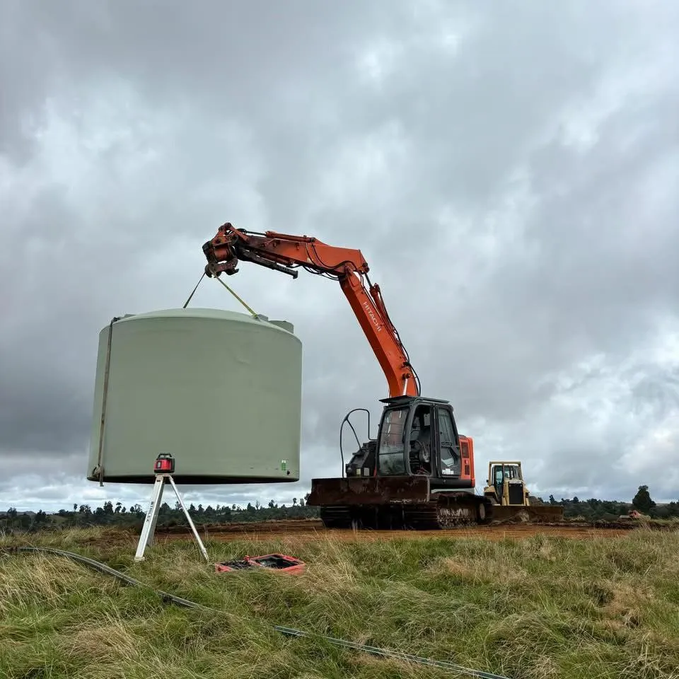 Water schemes project installation with large tank being placed on-site for a rural area.