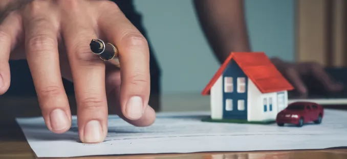 Home buyer looking over financing options while considering budget constraints