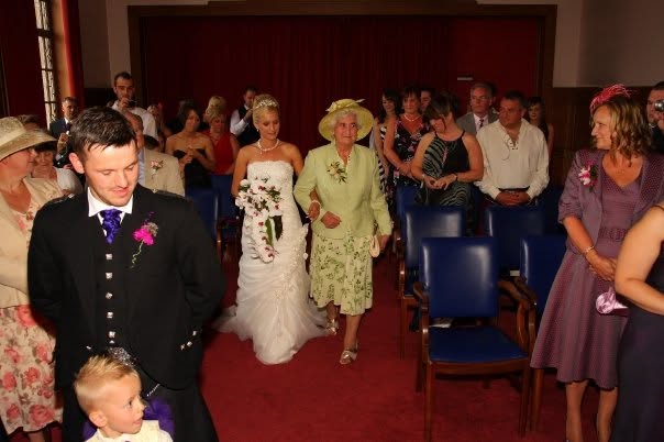 A warm vintage photo of Gran at her wedding, capturing a nostalgic and emotional moment