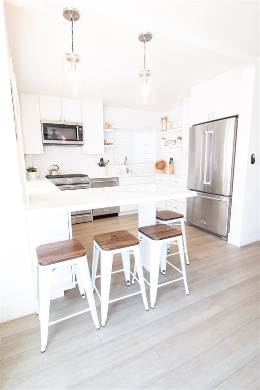 woman setting sheets on bed