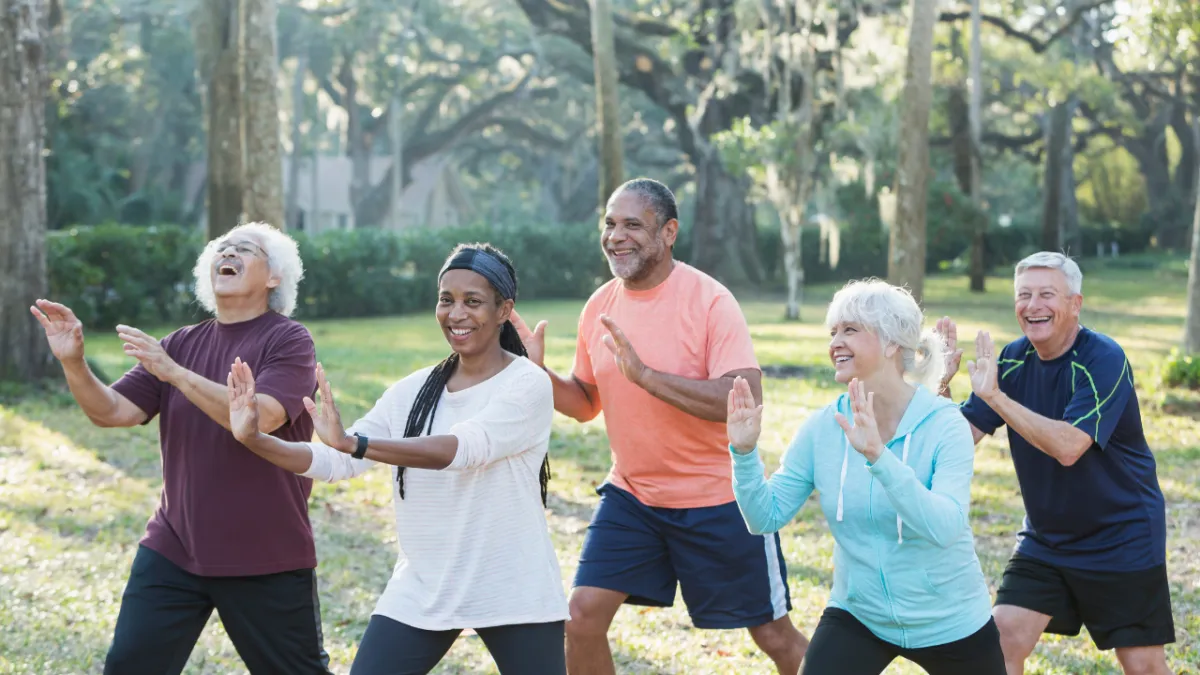 a group of older people enjoying tai chi