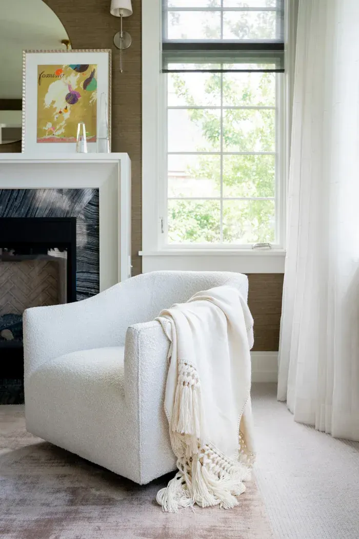 Cozy living area staging with accent chair and soft textiles