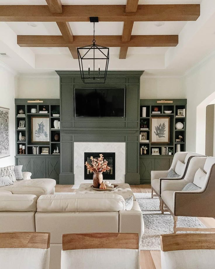 Professionally staged living room with fireplace and neutral seating