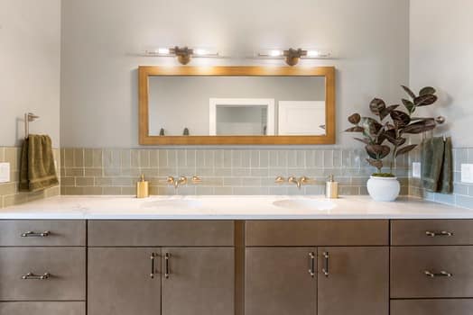 Clean bathroom staging with modern vanity and neutral finishes