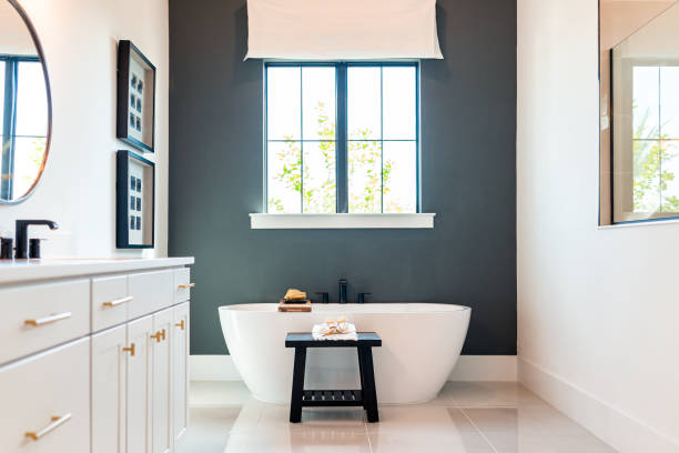 Modern bathroom staging with freestanding tub and natural light