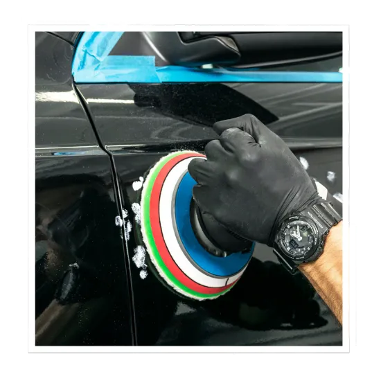 Paint correction service in Reston, VA inside a clean detailing bay