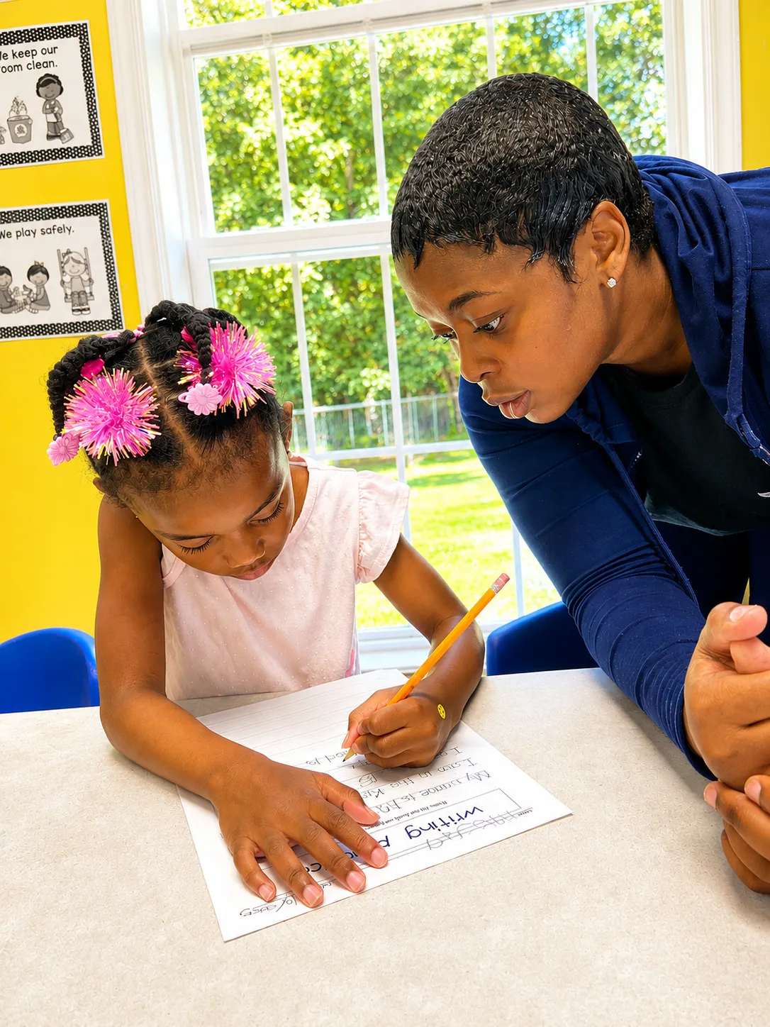 Children doing homework with staff