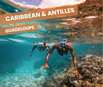 a man standing on top of a cliff overlooking a valley