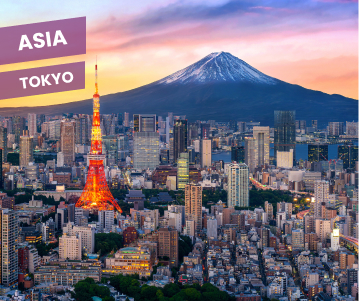 man in green jacket standing on rock formation near body of water