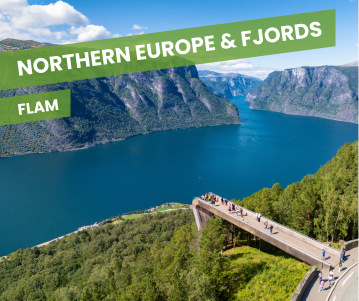 a man standing on top of a cliff overlooking a valley