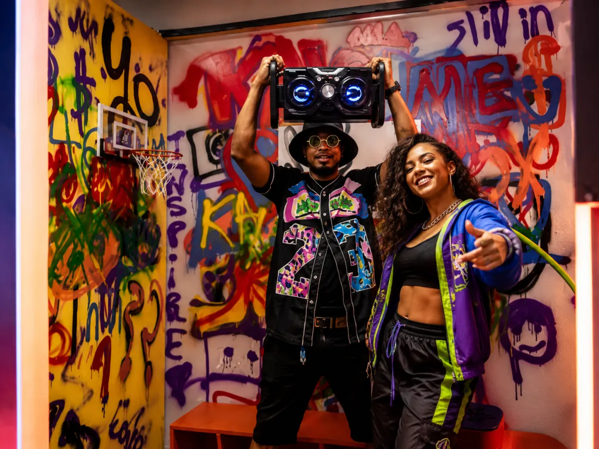 Couple laughing in the Neon Nights selfie room