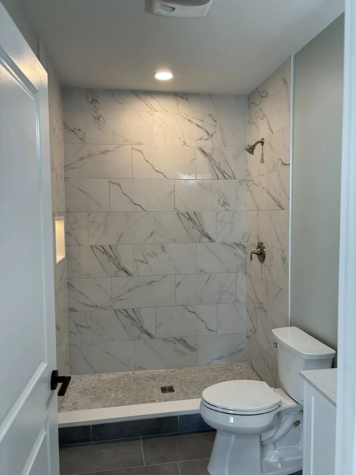 Tub-to-shower conversion in Winchester, VA with custom tile work