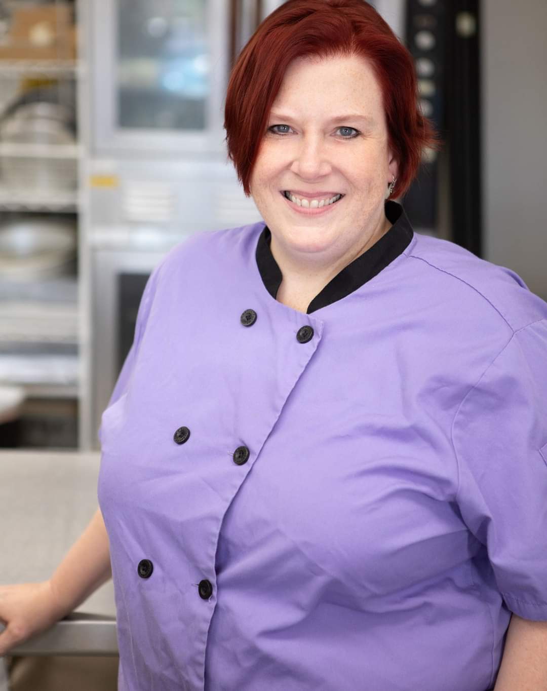 Pastry Chef Erica Bentson in a coral chef coat