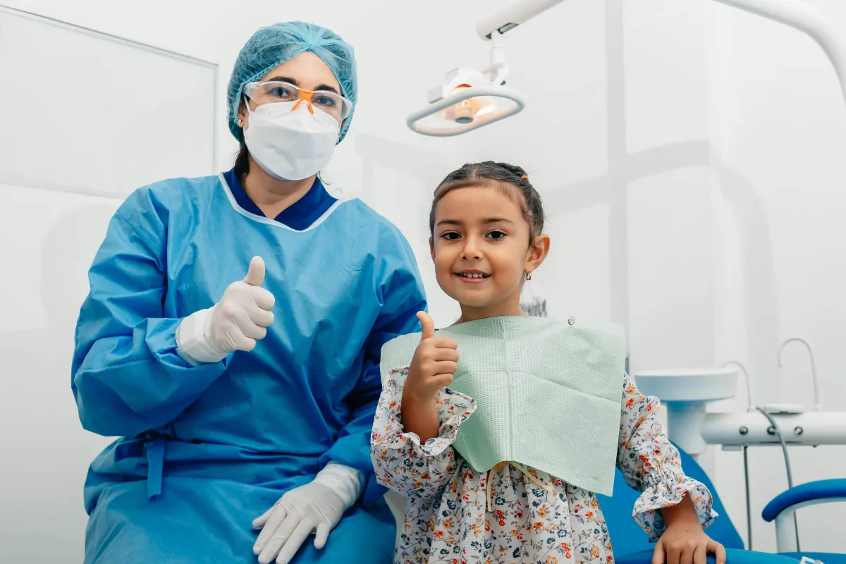 Female Vancouver dentist doing child's dental treatment paid by health insurance