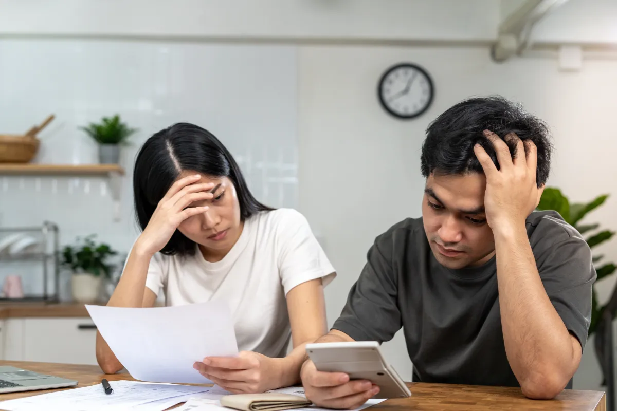 Vancouver couple reviewing their monthly bills on disability income