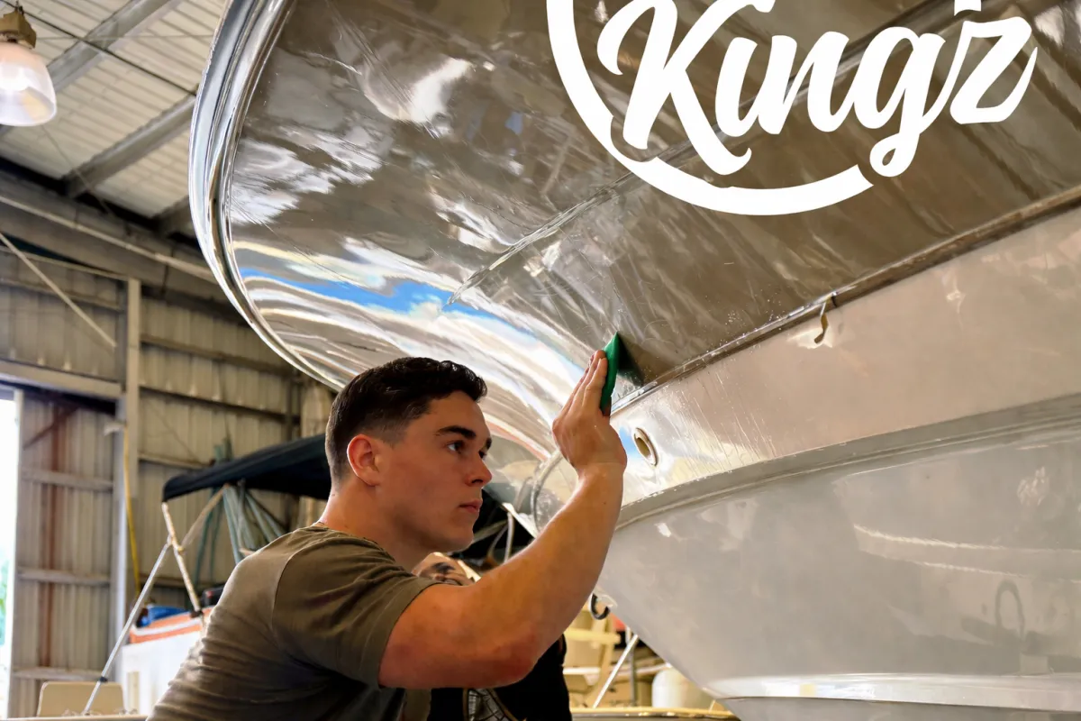 Close-up of a marine hull with XPEL paint protection film applied