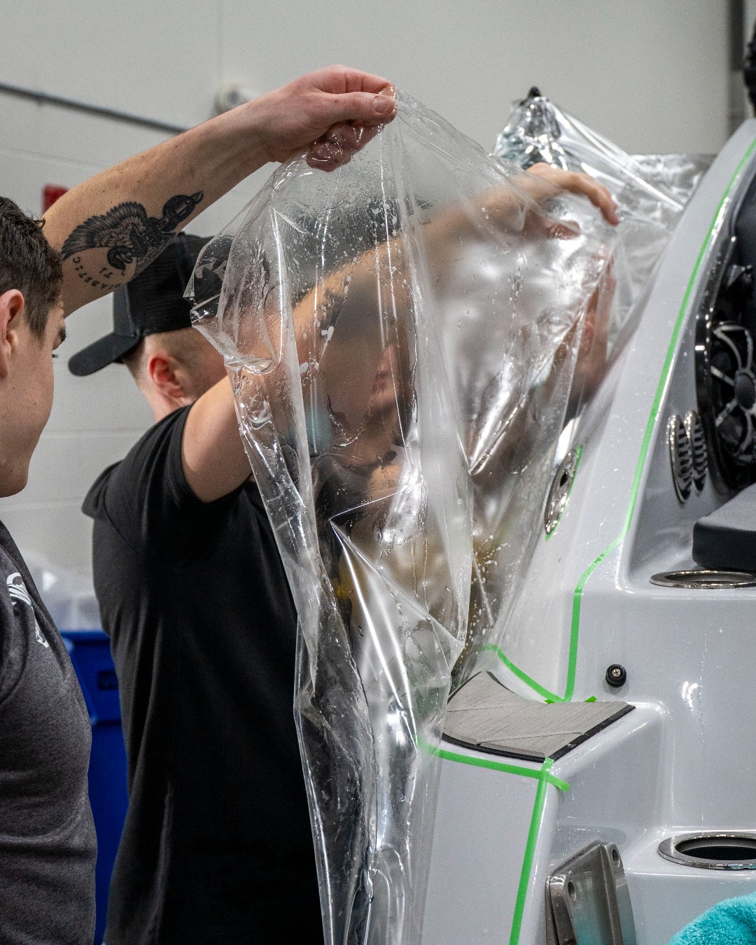 XPEL Certified marine installer applying paint protection film to a boat