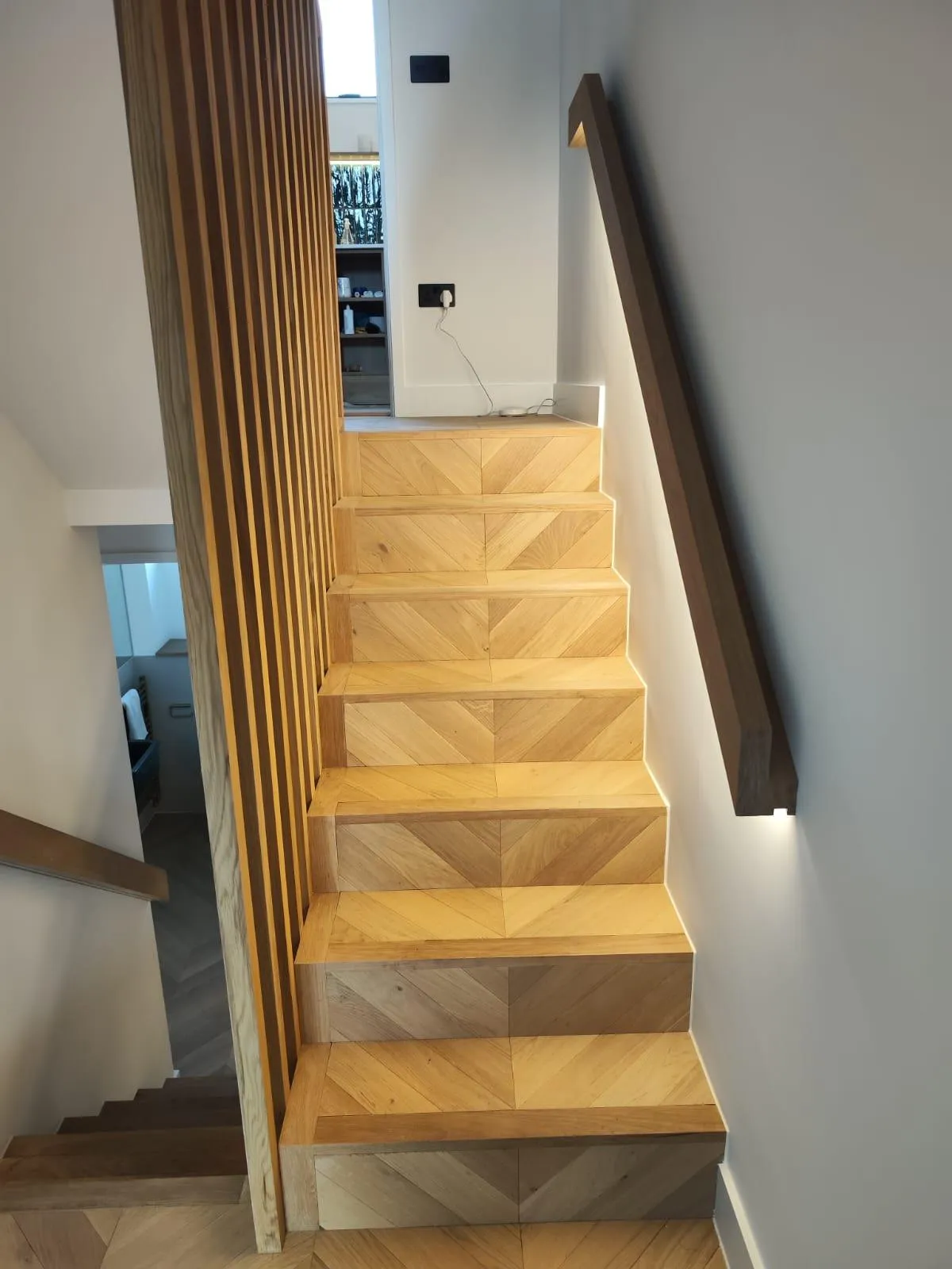 Custom built-in wooden cabinets and shelves designed to maximize home storage space