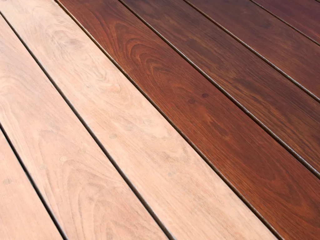Wood deck staining using a protective finish in a backyard in Broward County