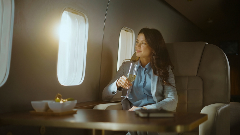 A private jet parked on an airport tarmac.