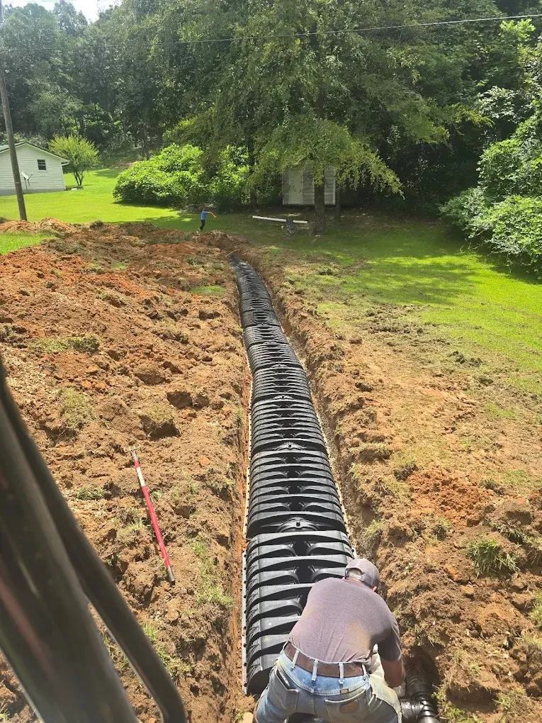 a man is placing something in a cement bowl