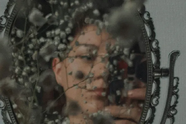 Woman looking at the mirror