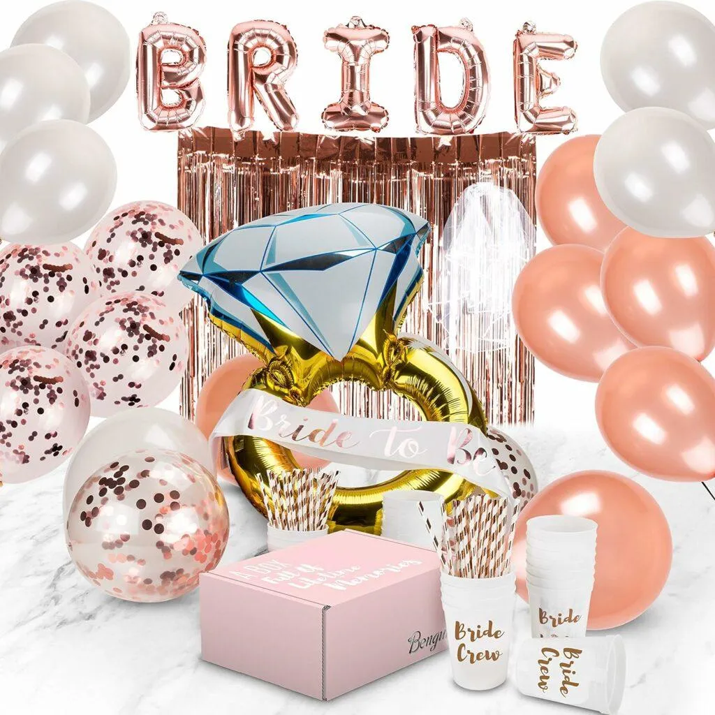 A glamorous bachelorette party setup in Kansas City featuring rose gold balloons, a giant diamond ring decoration, and festive "Bride" lettering.