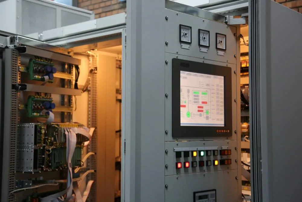 Hydroelectric control panel with PLC display inside a power station – part of ETS control system installation and service