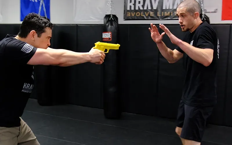 Students practicing a defensive handgun scenario as part of the Nomad Mixed Combat system, combining firearms training with practical real-world self-defense principles in the Fort Smith, Arkansas metro area.