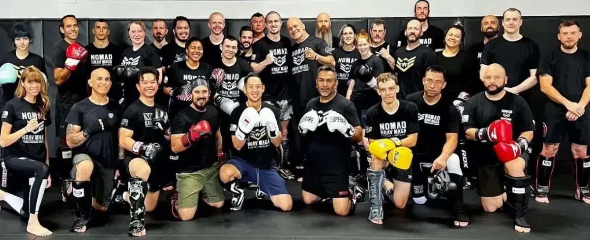 Adult students training together at Nomad Mixed Combat HQ in the Fort Smith, Arkansas metro area, building confidence, strength, and real-world self-defense skills through expert coaching.