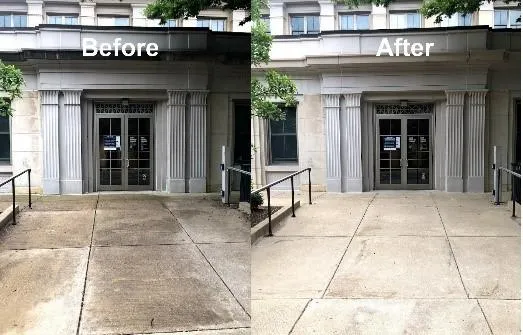 Professional team performing power washing on a commercial parking lot"