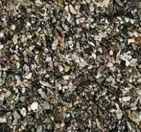 Gravel used for enhancing traction on slippery surfaces during winter weather.