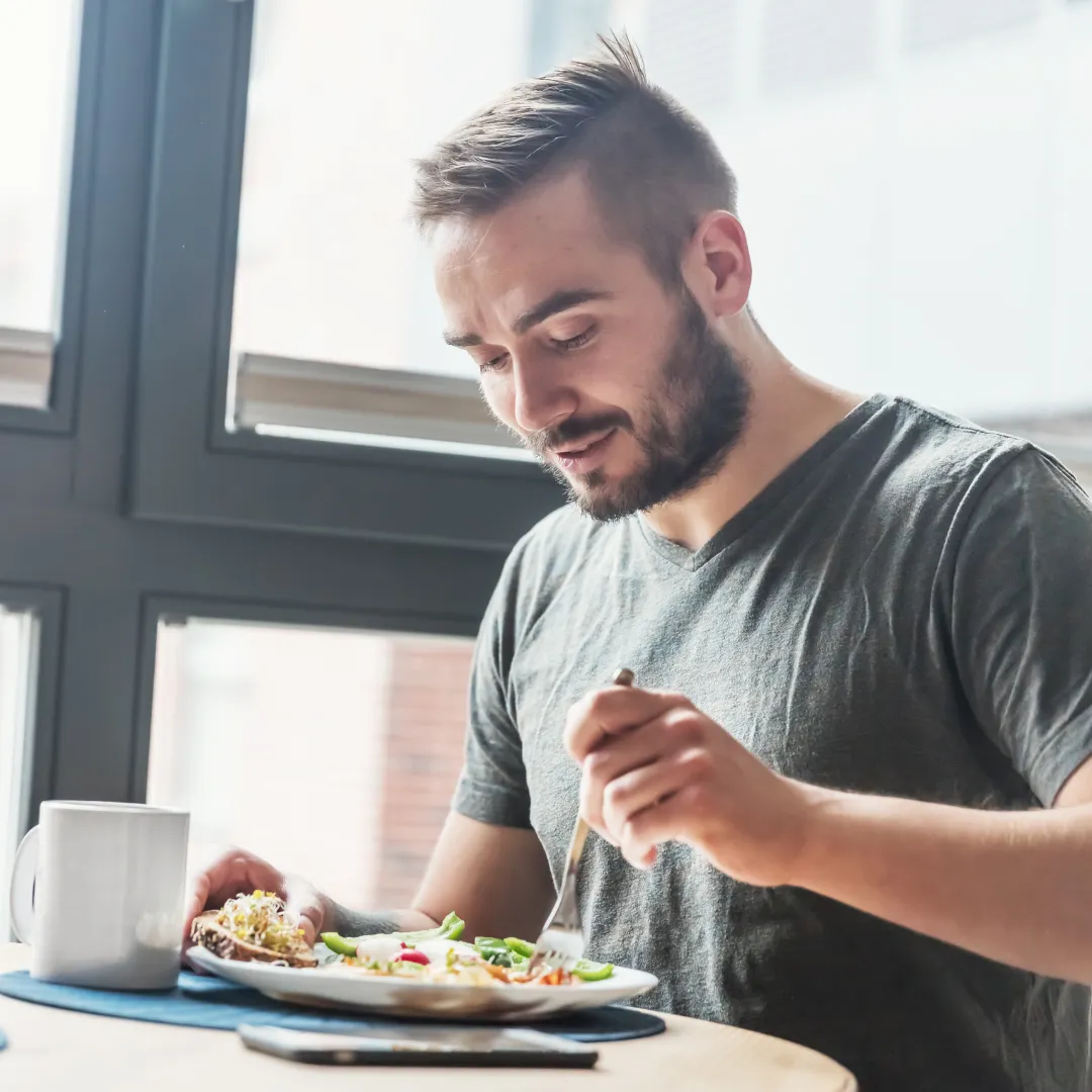 Man enjoying a protein-forward Ideal Protein meal to preserve muscle mass while taking GLP-1 medications