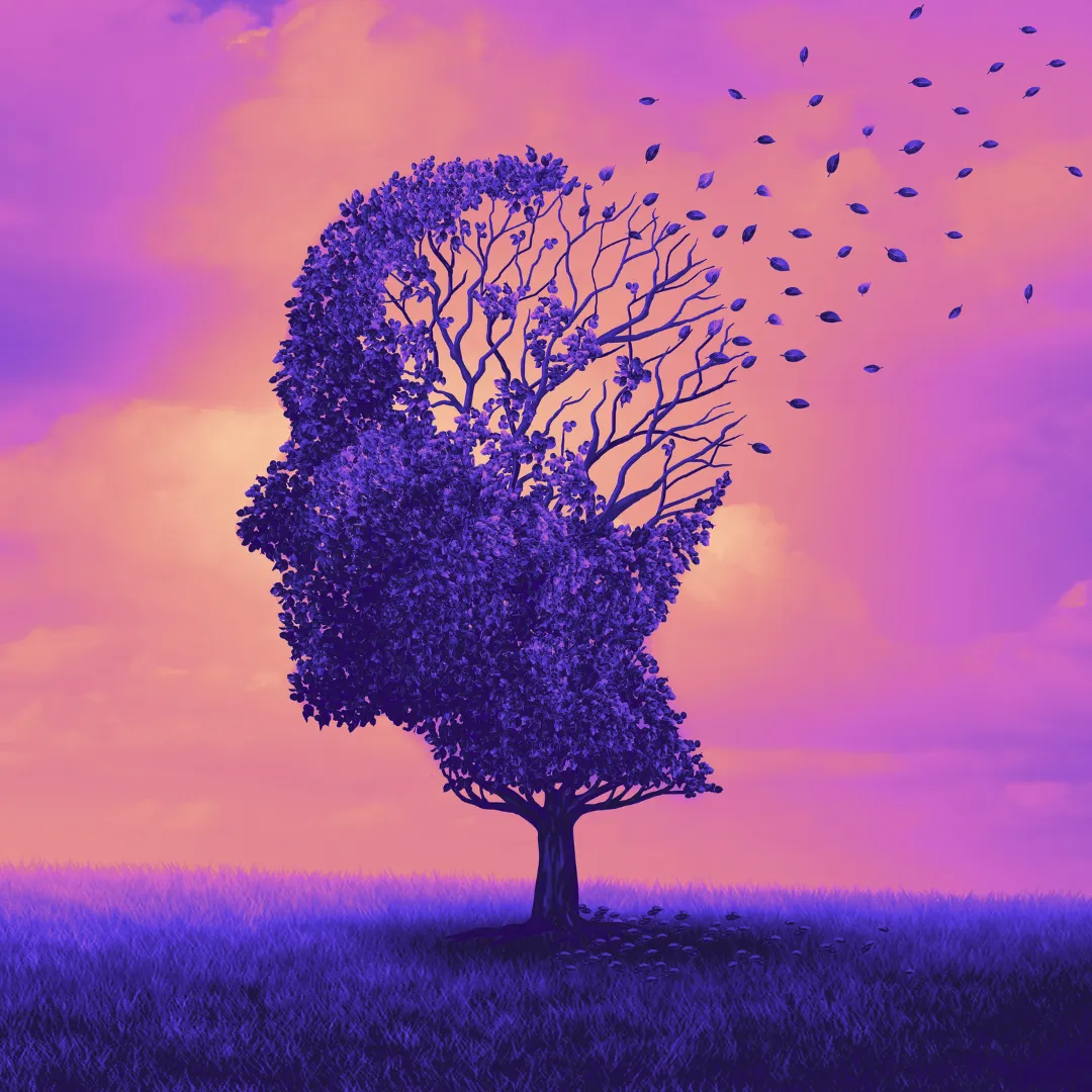 outline of a head by a tree with leaves disintegrating