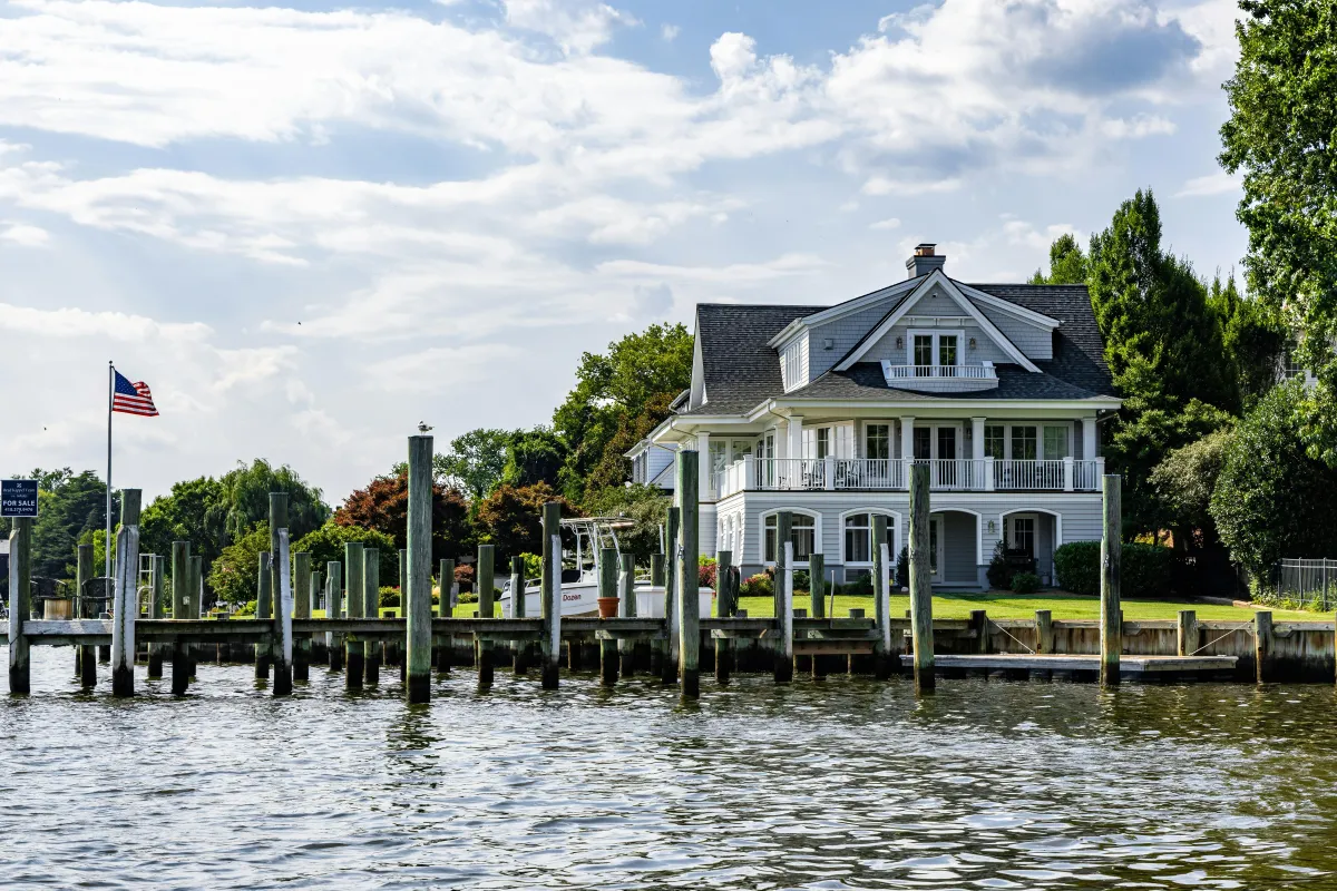 Waterfront home with private frontage and a seasonal dock on White Lake near Whitehall, Michigan