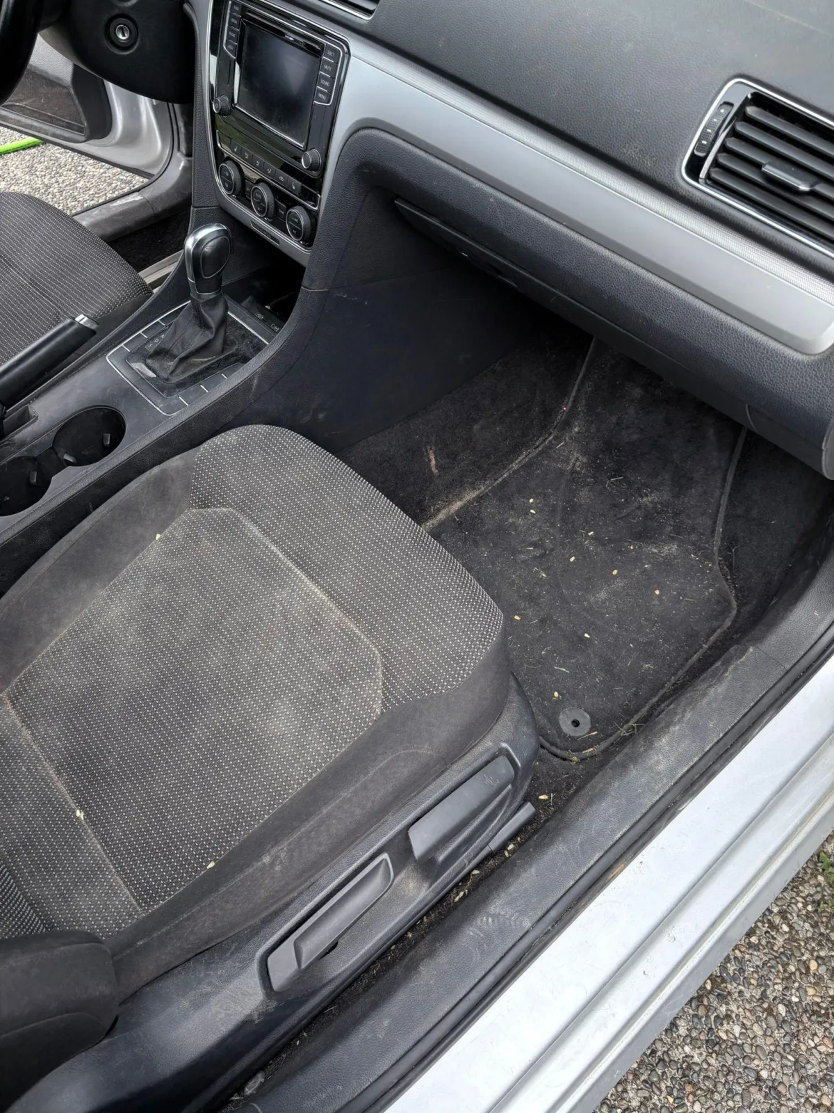 Dirty floor mats and seat before interior detail