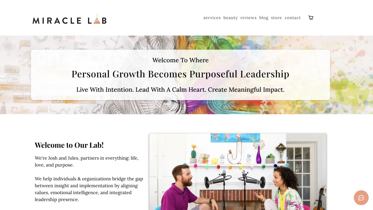 a black and white vase sitting on top of a table